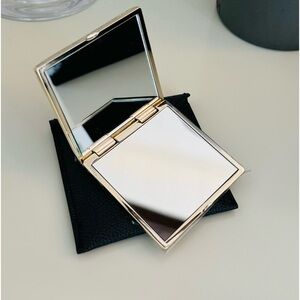 Dual-sided Versace cosmetic mirror with case.